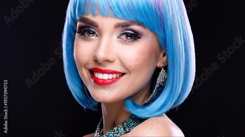 Elegant woman with blue hair and purple accessories smiling on black background