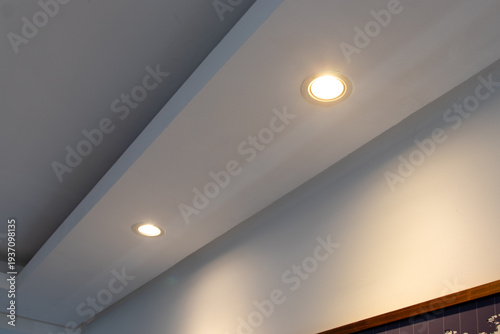 Foto Detail of recessed ceiling lighting with LED spotlights lit in a residential interior