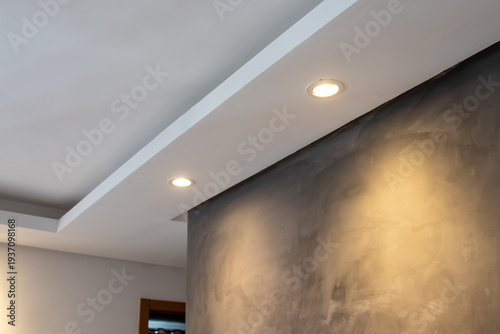 Foto Detail of recessed ceiling lighting with LED spotlights lit in a residential interior