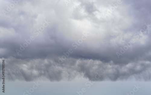 Ominous cloud formation hovering low over the horizon