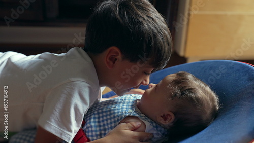 Cuadro en lienzo Young boy gently touching baby sibling’s nose, soft bonding moment, brotherly lo