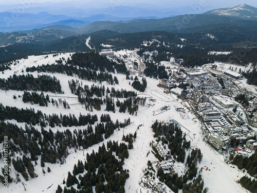 View of Kopaonik ski resort in Raska District Serbia with snow covered slopes and forest in winter season