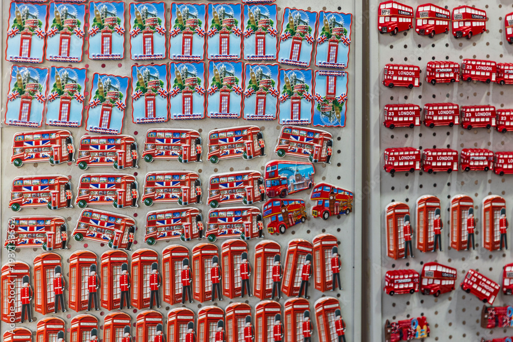 Obraz premium London, UK, December 13, 2025, Collection of colorful London souvenir magnets featuring double decker buses and telephone booths.