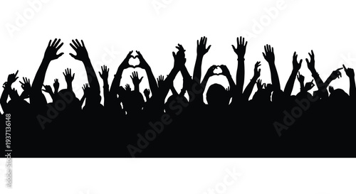 A large crowd of silhouetted people with arms raised in a celebratory or excited gesture