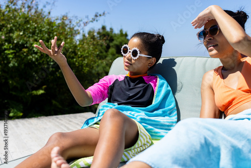 Titan shoreline showing bright horizontal band with triangular island and rounded spot