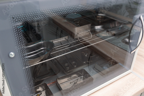 Sterile processing cabinet filled with stainless surgical tools and trays, ideal for healthcare training, safety materials, and medtech catalogs.
