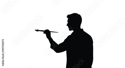 A painter holds a brush in profile a striking black silhouette