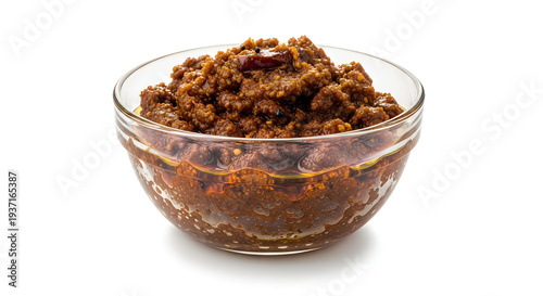 Wallpaper Mural A glass bowl of brown spice mix or chutney isolated on white background Torontodigital.ca