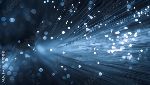 Abstract image showing glowing blue fiber optic strands spreading outwards from central light source representing high-speed internet data transfer digital network concept