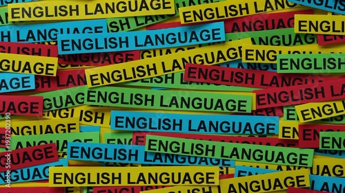 A vibrant background of colorful paper strips with the words English Language typed on them. Close up.