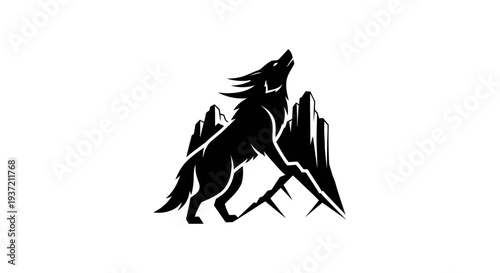 Silhouette of wolf howling over mountains