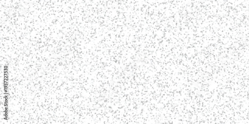 Abstract white background with a fine granular texture composed of numerous small, irregular light gray shapes for versatile design applications