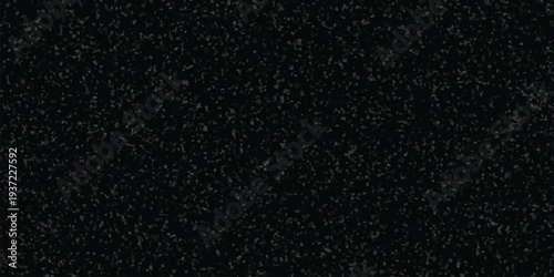 Dark abstract background with a dense, speckled pattern of grey irregular shapes offering a subtle granular texture for design use