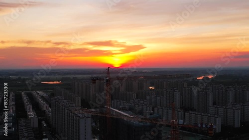 Urban Construction Site at Sunset with Aerial Cityscape View