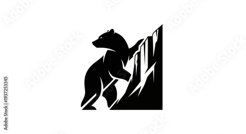 Silhouette of bear climbing rock