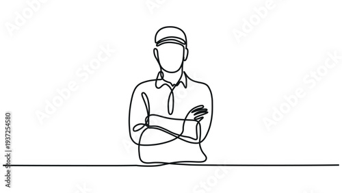 A man with his arms crossed standing behind a counter