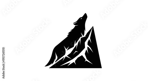 Silhouette of a wolf howling on a mountain