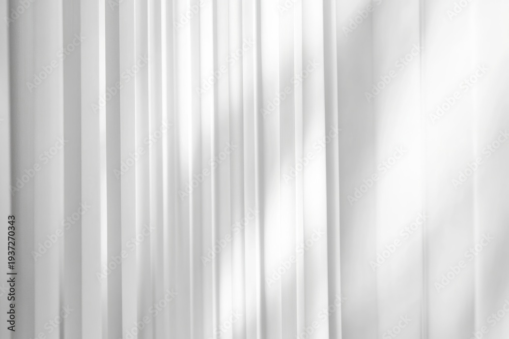 Fototapeta premium Abstract white background with vertical ribbed texture and soft light creating a simple visual effect