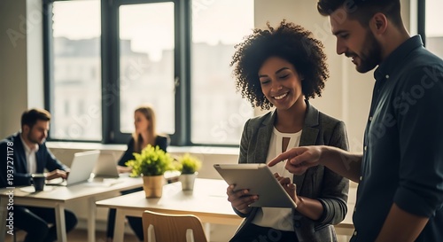A diverse group of colleagues collaborating and working together in a modern office space