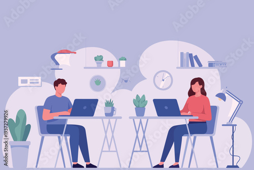 Two people working on laptops at a desk in a modern office space