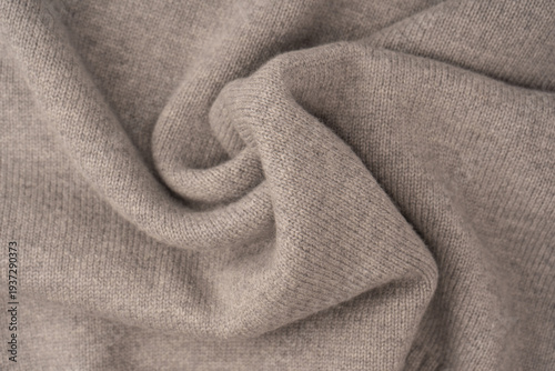 Soft grey merino wool sweater texture as a background.