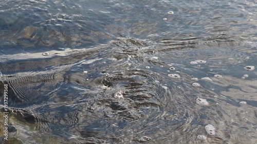 Vortex formations. Vortexes forming in a stream after heavy rain. 