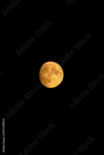 Full moon in dark night sky 