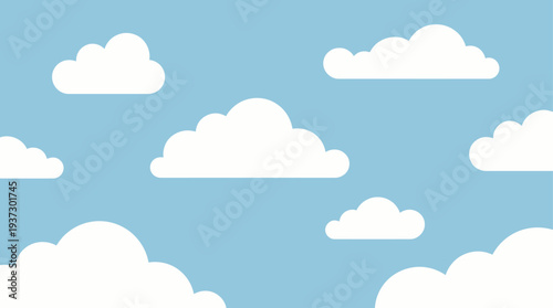 White clouds float gently across a clear blue sky on a serene day viewed from below