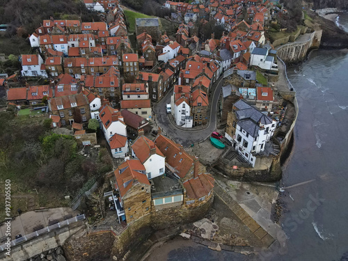 Aerial view of Robin Hood's Bay village and harbour coastline, North Yorkshire; historic fishing village on Yorkshire Coast, North York Moors National Park, England, UK
