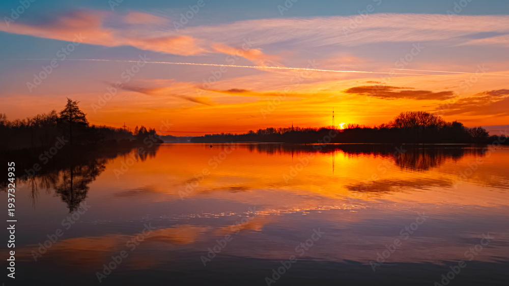Fototapeta premium Winter sunset or sundowner view with reflections near Plattling, Isar, Deggendorf, Bavaria, Germany