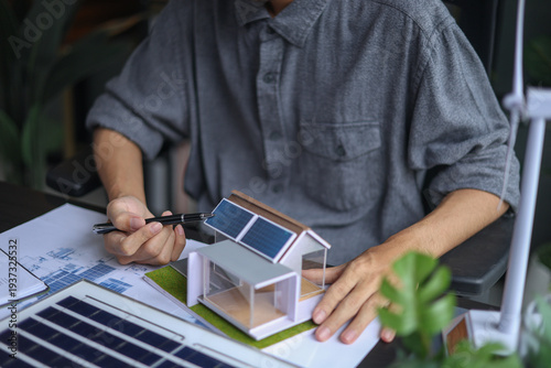 Architect Working on renewable Energy Housing Project.