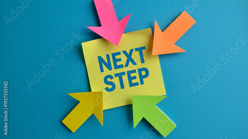 Colorful sticky note with next step message and arrows