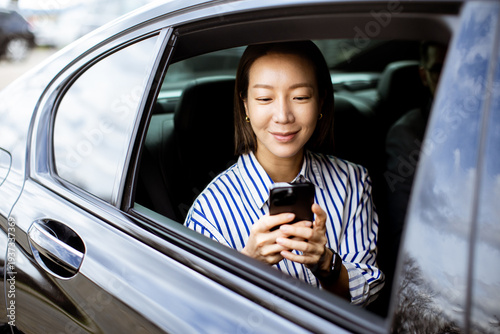 Korean woman sitting in a c...