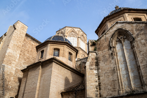 Valencia Cathedral and Royal Basilica of Our Lady of the Forsaken (Real Basílica de Nuestra Señora de los Desamparados) from Plaza de la Virgen, Valencia, Spain. 
