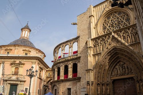 Valencia Cathedral and Royal Basilica of Our Lady of the Forsaken (Real Basílica de Nuestra Señora de los Desamparados) from Plaza de la Virgen, Valencia, Spain. 