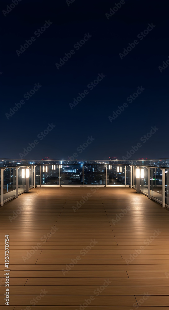 Obraz premium Expansive wooden deck balcony overlooking a sprawling city skyline illuminated by the warm glow of night lights under a deep blue twilight sky creating a serene urban vista