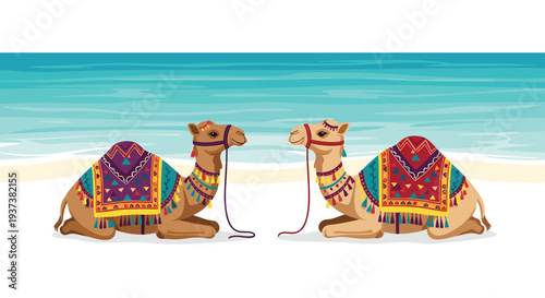 Two elaborately adorned brown camels, each wearing a colorful patterned saddle blanket, sit facing each other on a pristine white sandy beach in front of a vibrant blue ocean.
