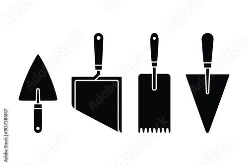 Black silhouettes of various trowels and spreaders for construction and masonry work on white background
