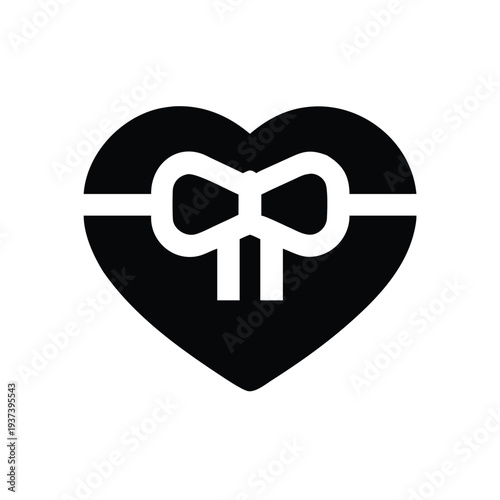 Heart shape with white ribbon tied around it in white  symbol of love and gift giving