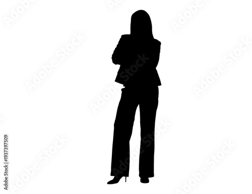 Silhouette of a confident businesswoman standing with crossed arms
