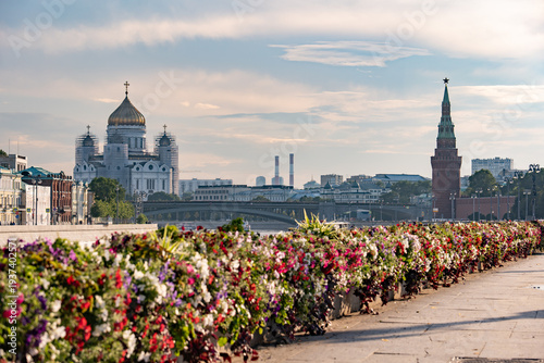 Moscow cityscape featuring Cathedral of Christ the Saviour and Kremlin tower along river
