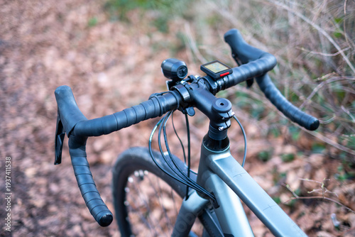 Close‑Up of Gravel Bike Handlebars on Forest Trail