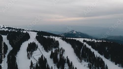 Explore Kopaonik in Raška District during winter with snowy slopes and mountain views in Serbia