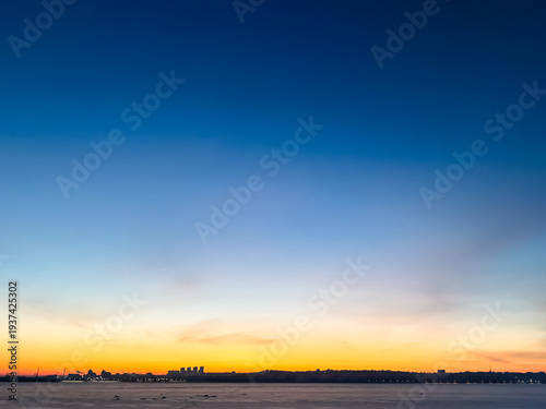 Blue Evening Sky Gradient Background with Soft Warm Horizon Light and Copy Space