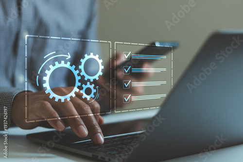 Business process automation concept with digital checklist and gear icons over laptop and smartphone. Workflow management, productivity improvement, task tracking, operational efficiency technology.