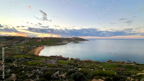 фотографія Ramla bay on gozo island at sunset showing mediterranean sea and coastline