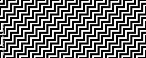 Minimalist seamless pattern of black and white diagonal staircase lines in a bold chevron style
