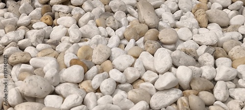 The white rock surface of the stone the background is rocky and full of rocks.