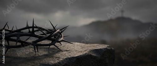 Crown of thorns on a stone with a silhouette of a cross on a hill. Dramatic religious background for Good Friday or Easter. Symbol of the crucifixion of Jesus Christ