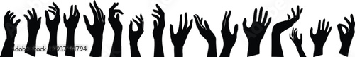 Black silhouette of many raised hands in various gestures
